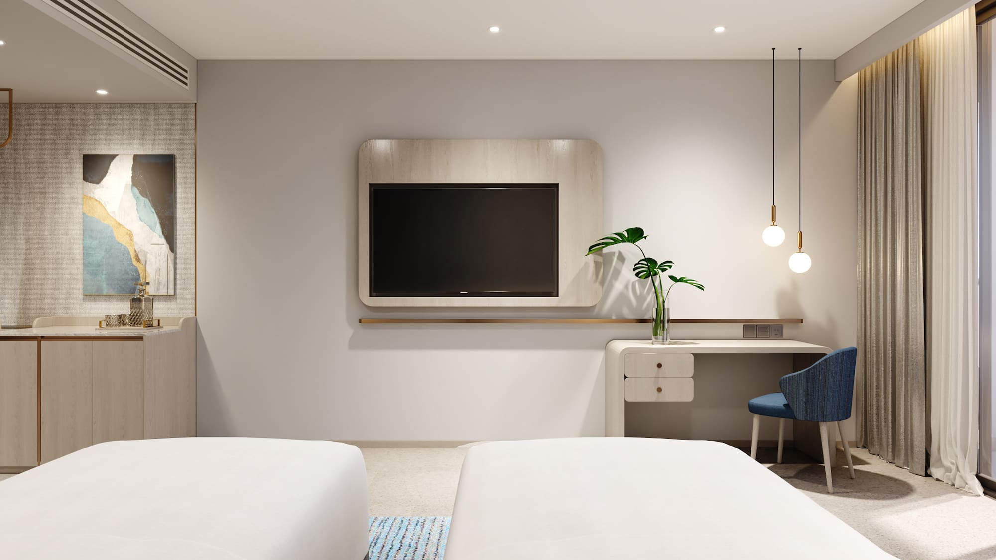 a room with two beds and a tv on the wall