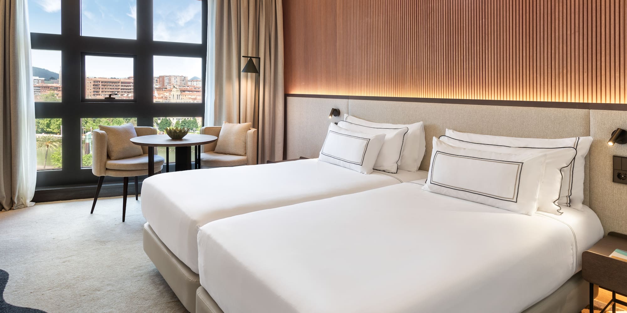 a hotel room with two beds