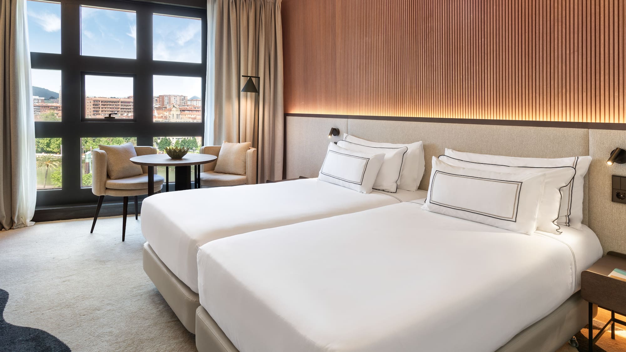 a hotel room with two beds