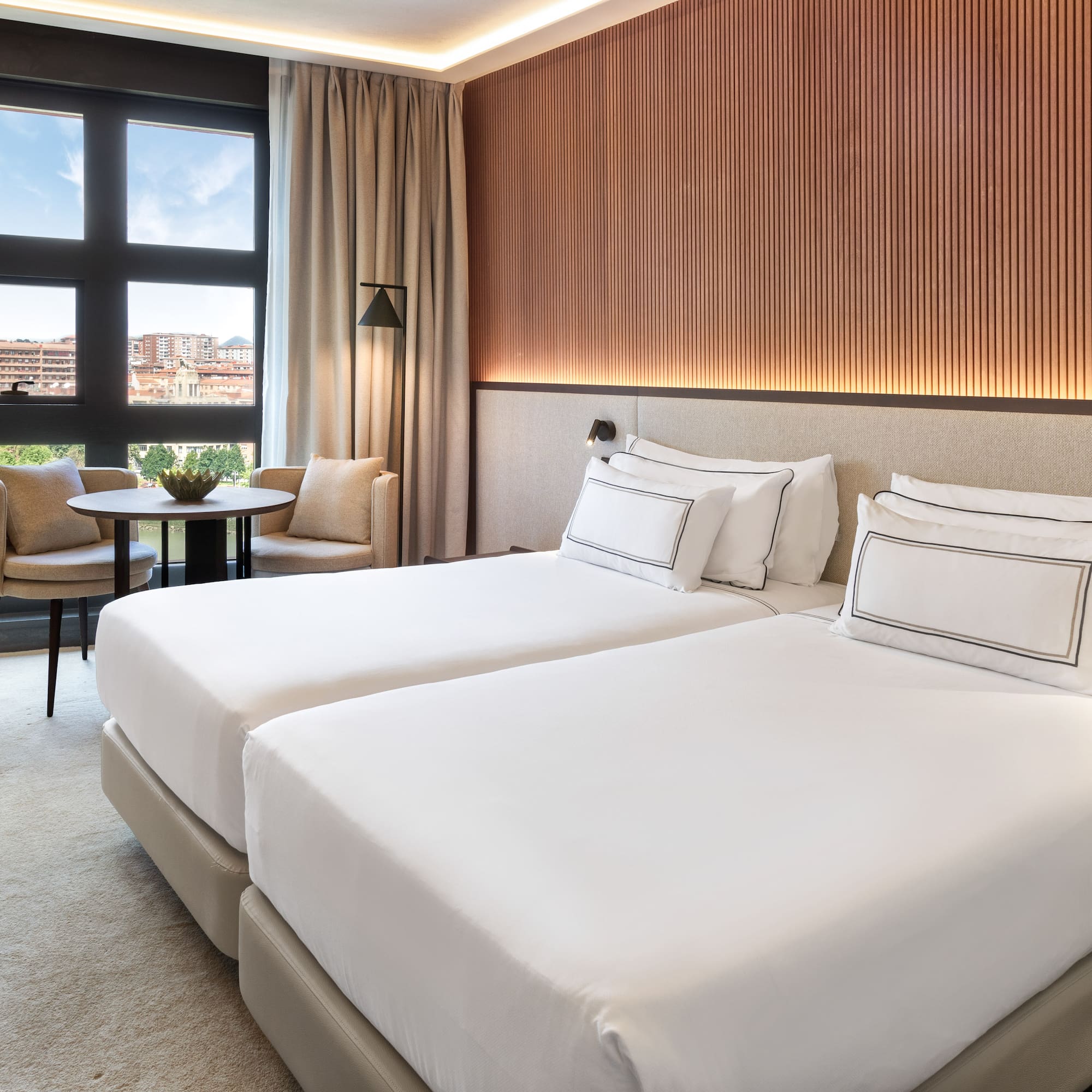 a hotel room with two beds