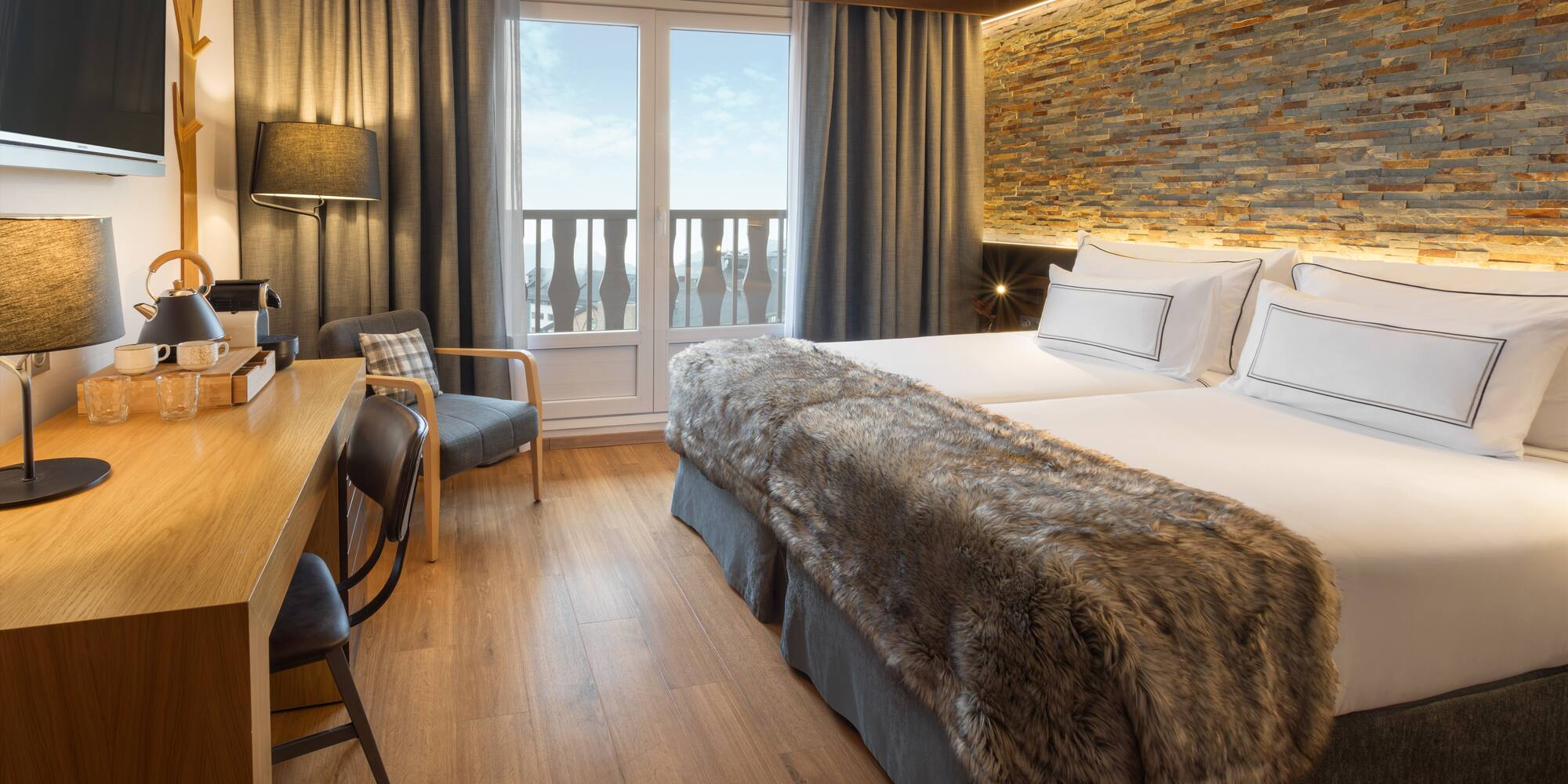 a room with a bed and a desk