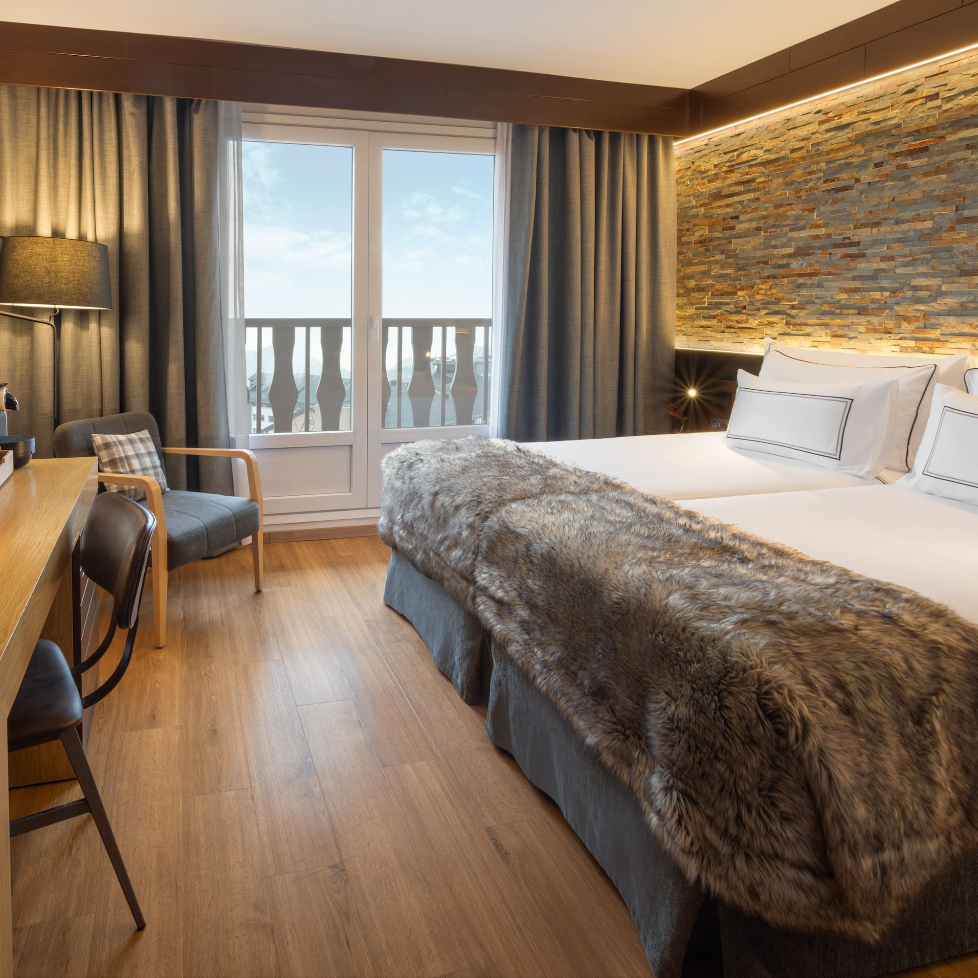 a room with a bed and a desk