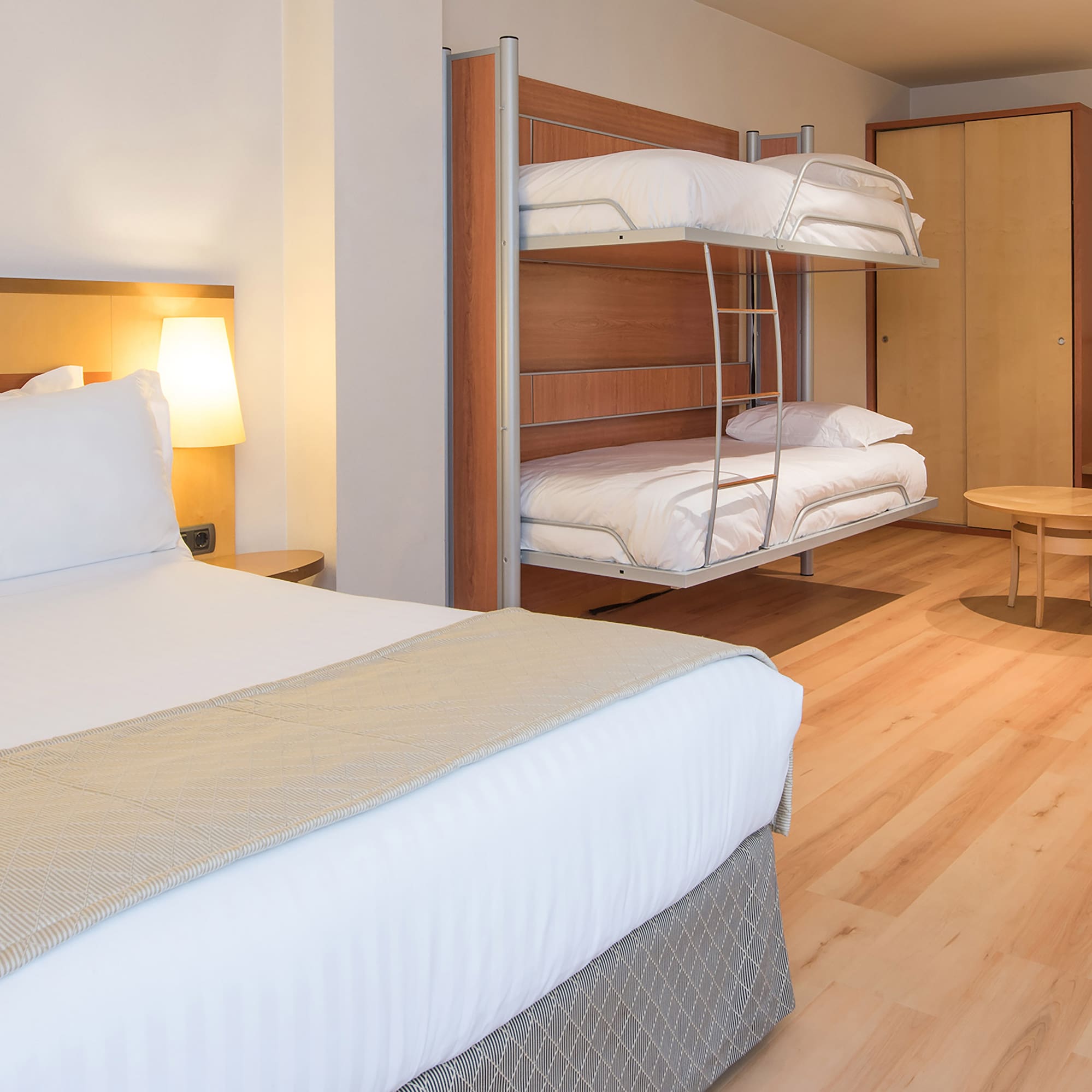 a room with bunk beds and a table