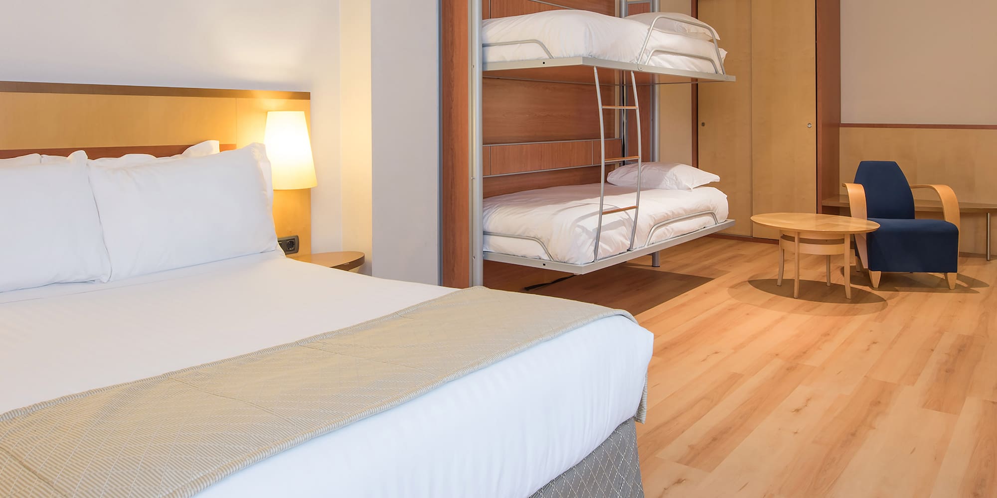 a room with bunk beds and a table