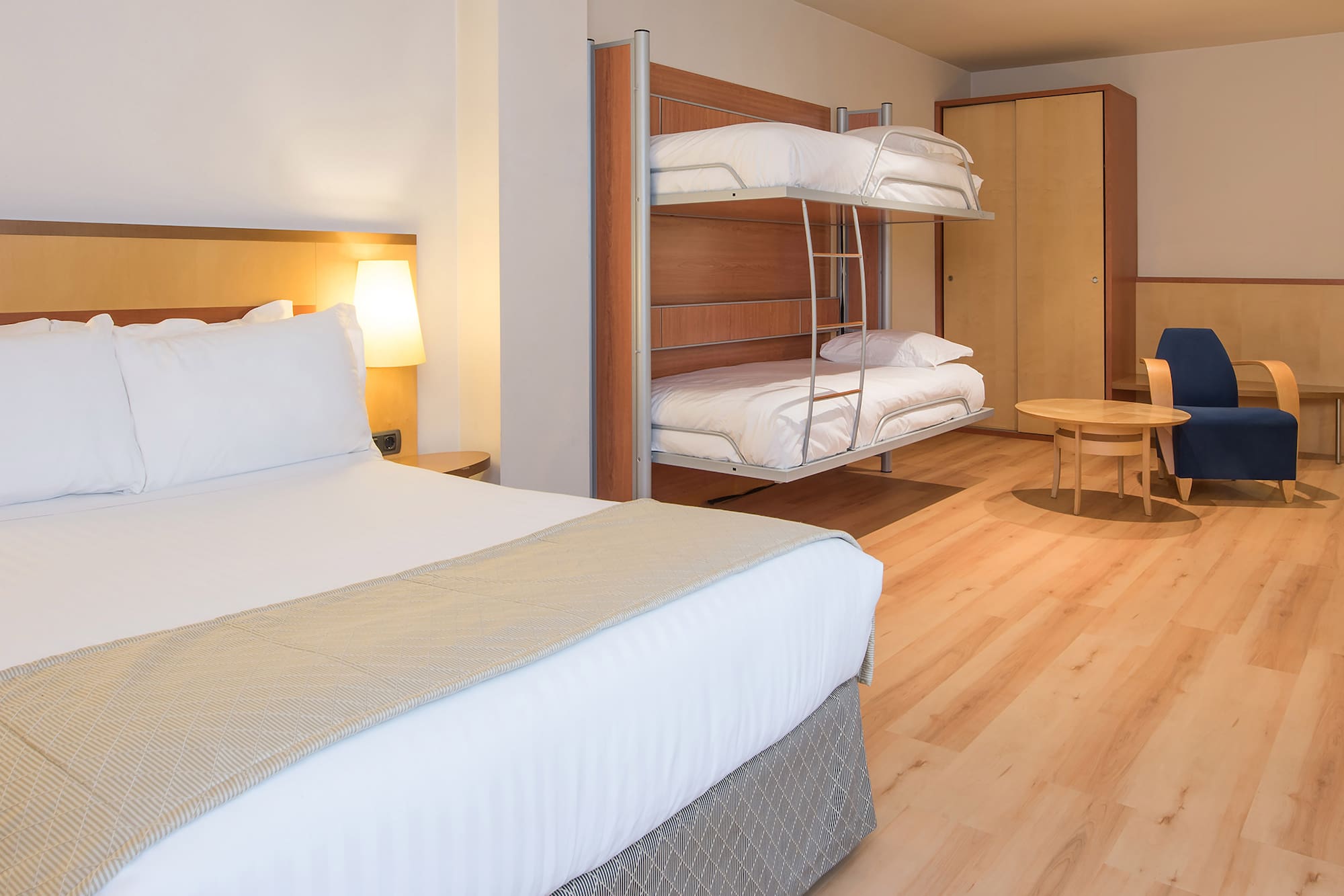 a room with bunk beds and a table