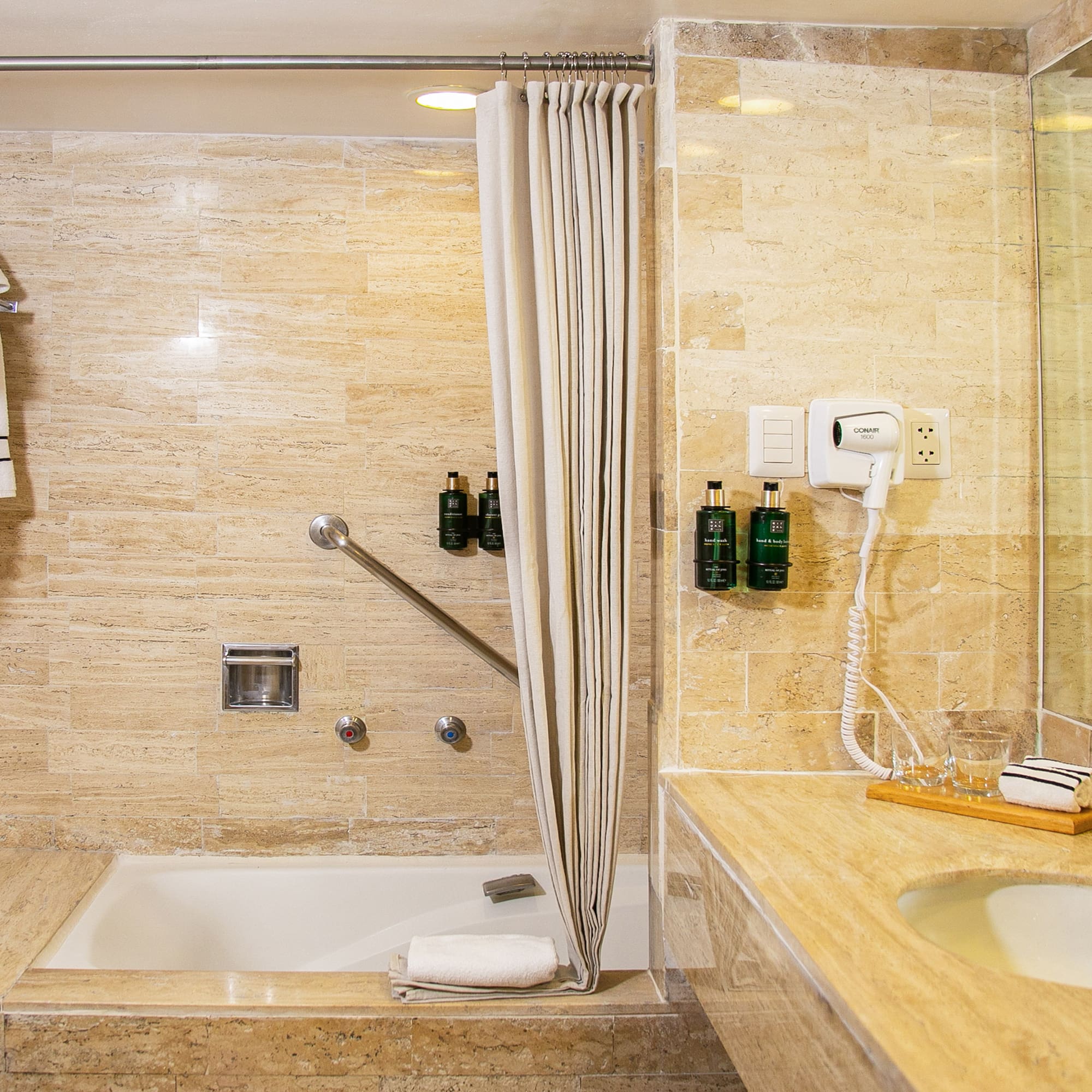 a bathroom with a shower and sink