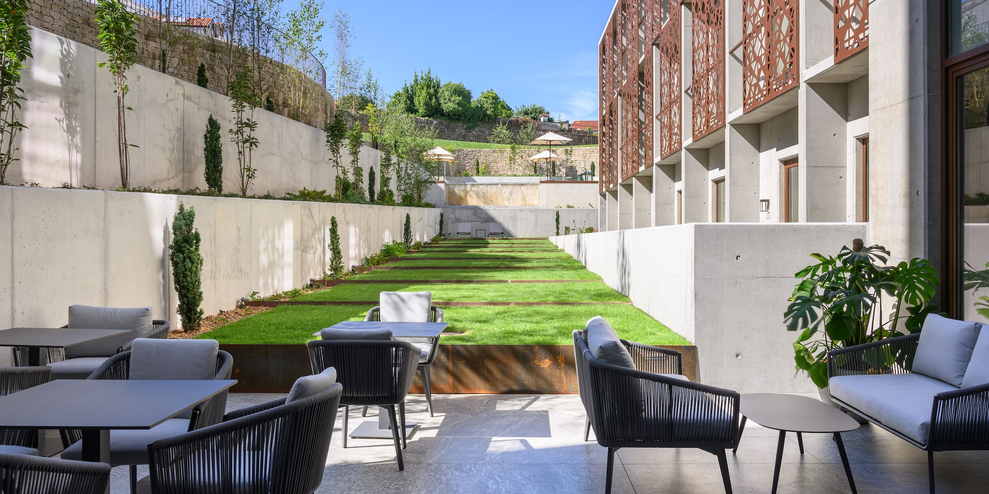a patio with chairs and tables