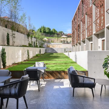 a patio with chairs and tables