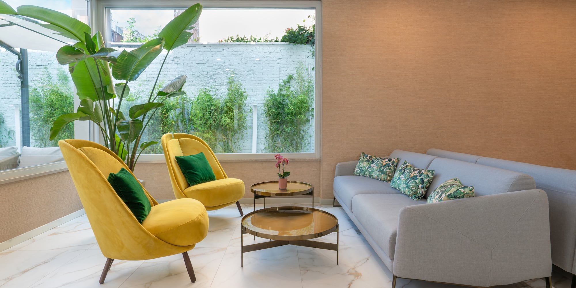 a room with a couch and a yellow chair