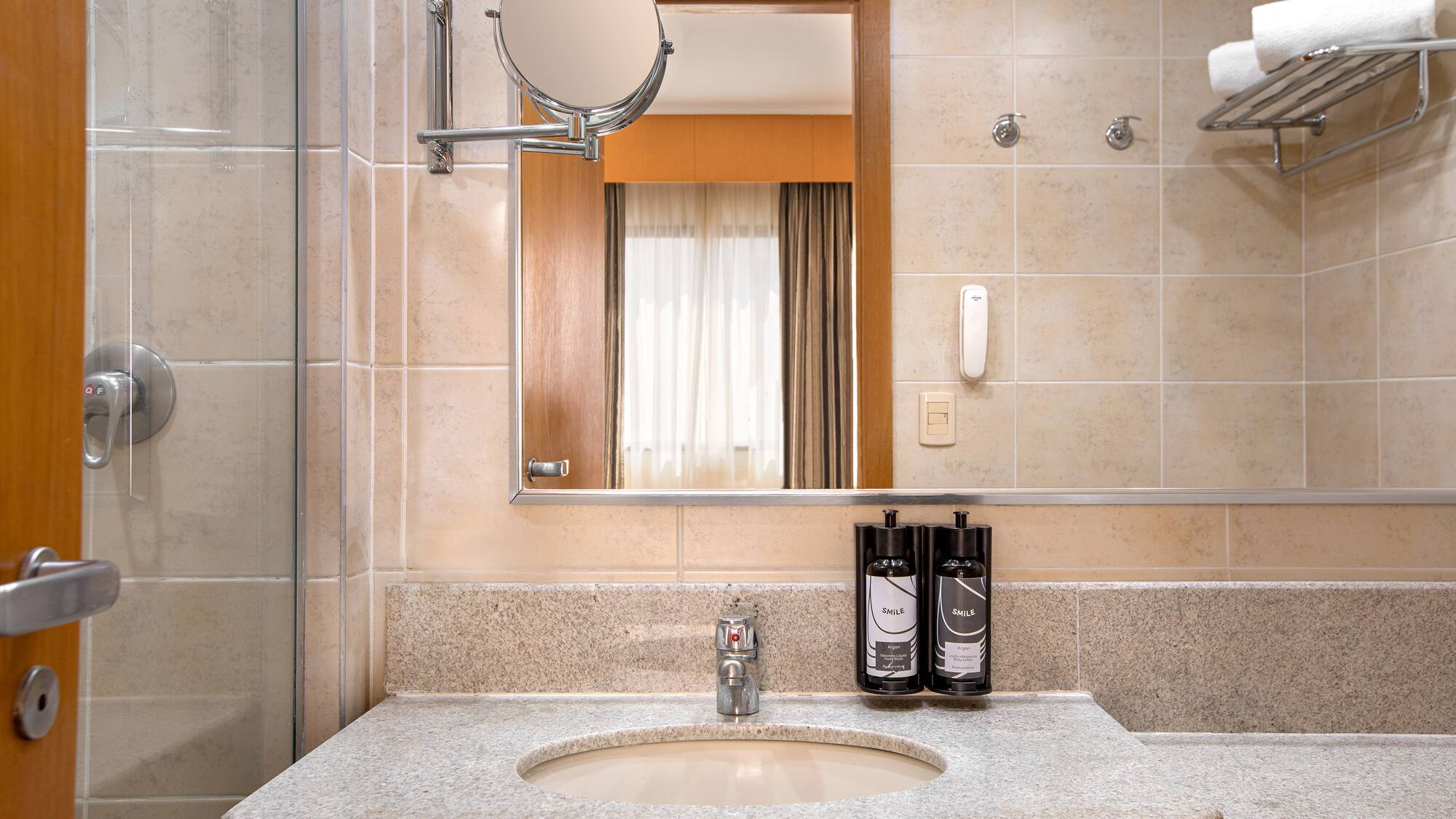 a bathroom with a mirror and a sink