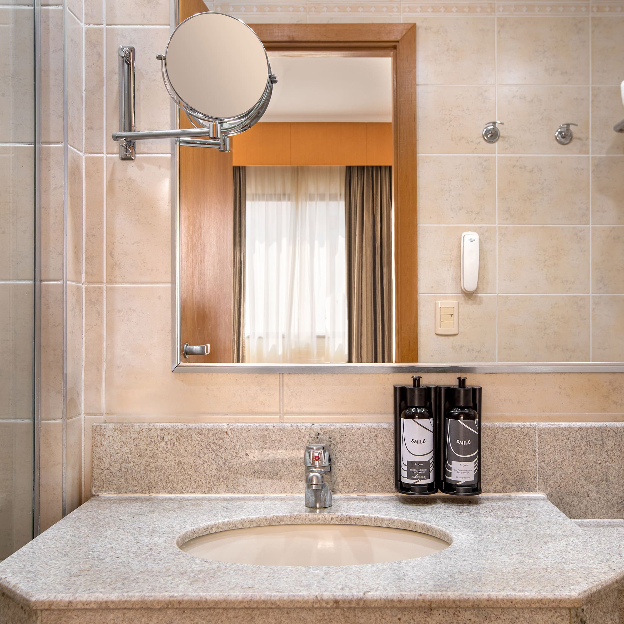 a bathroom with a mirror and a sink