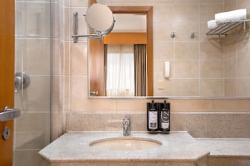 a bathroom with a mirror and a sink