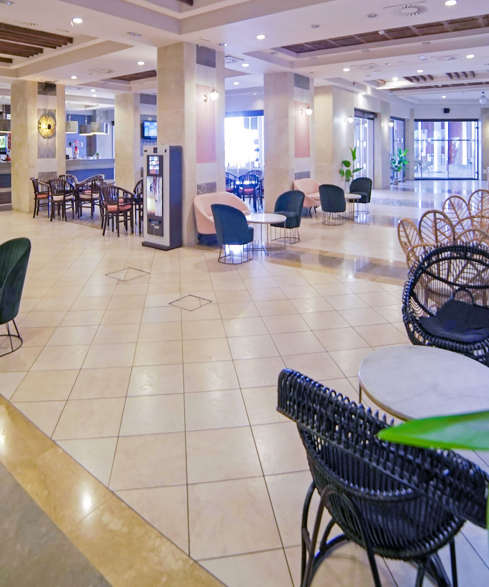 a large lobby with chairs and tables