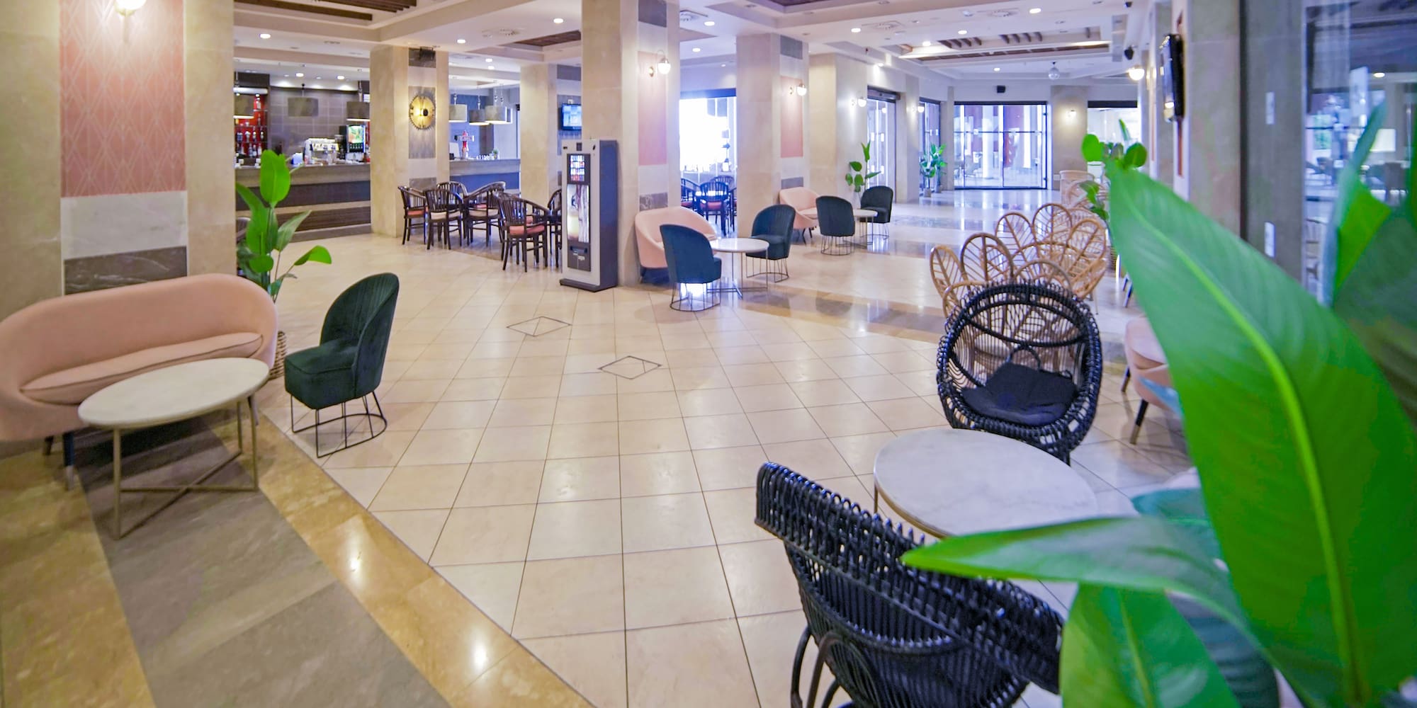 a large lobby with chairs and tables