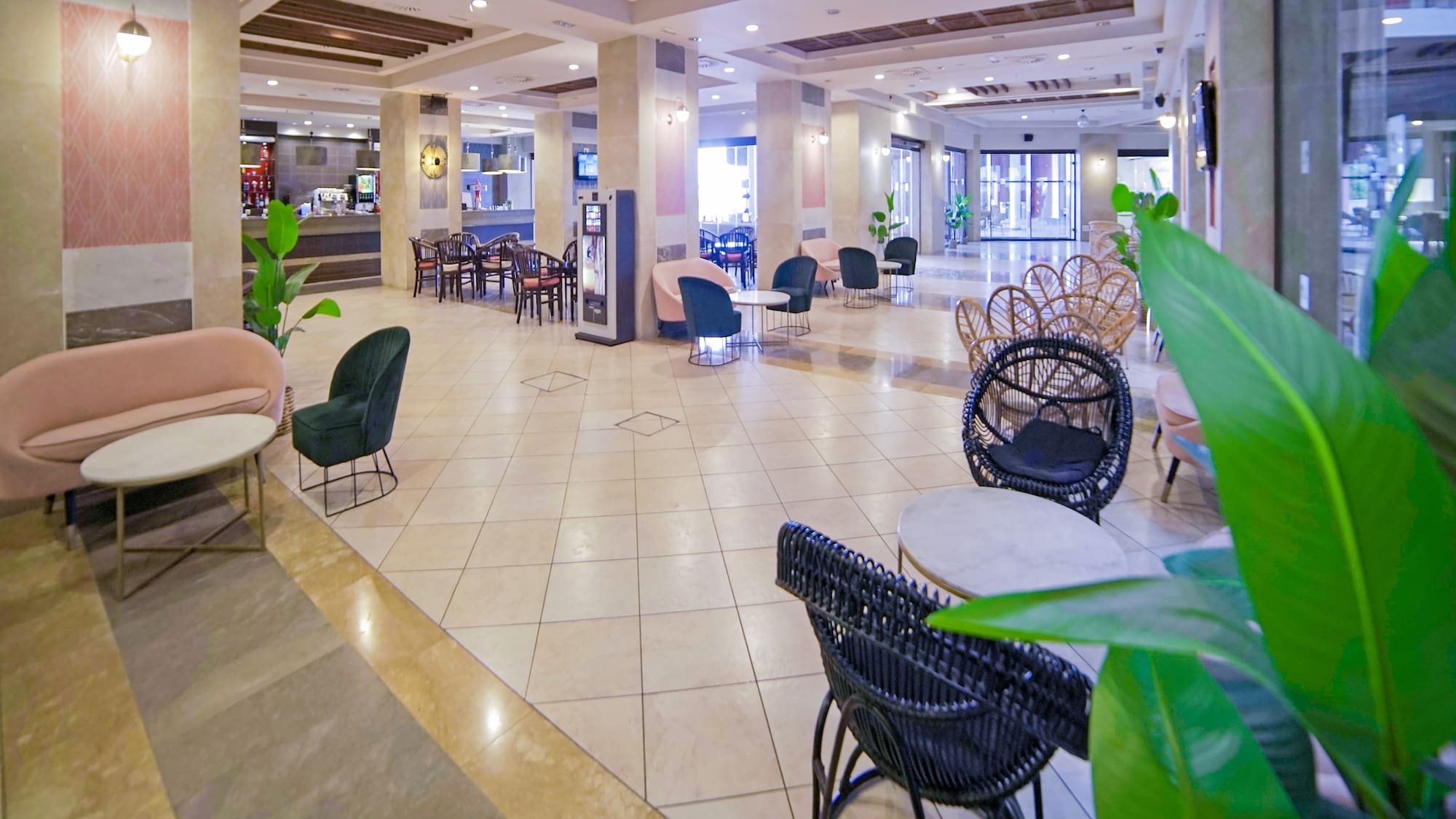 a large lobby with chairs and tables