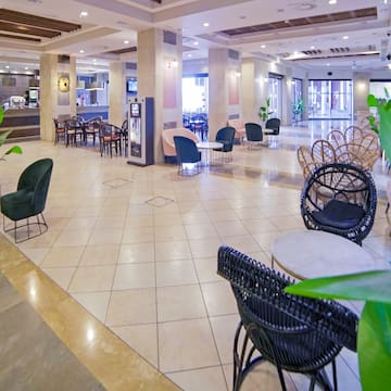 a large lobby with chairs and tables