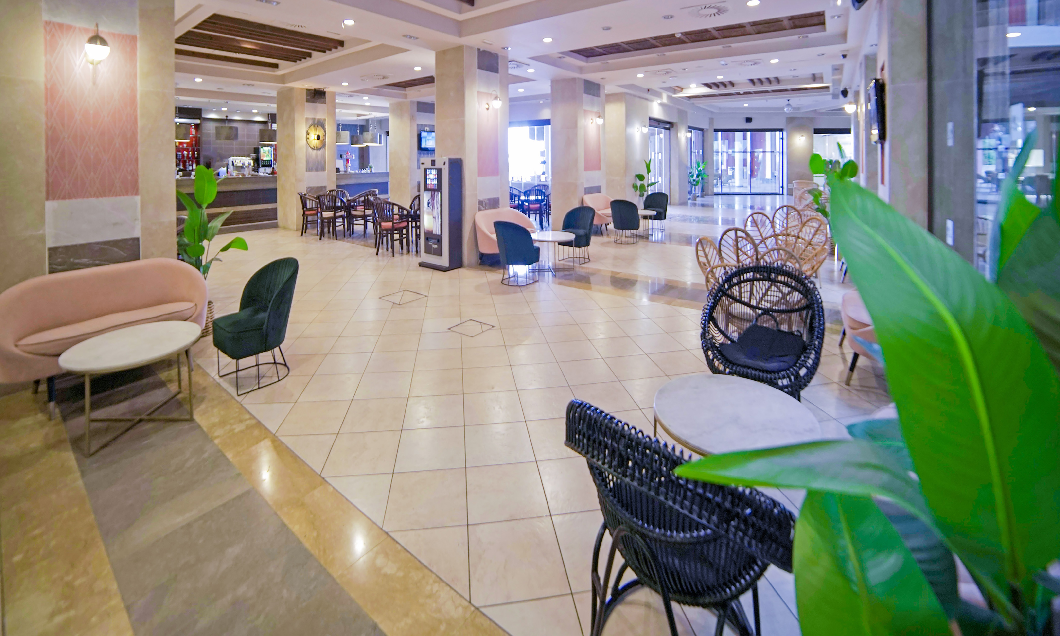 a large lobby with chairs and tables