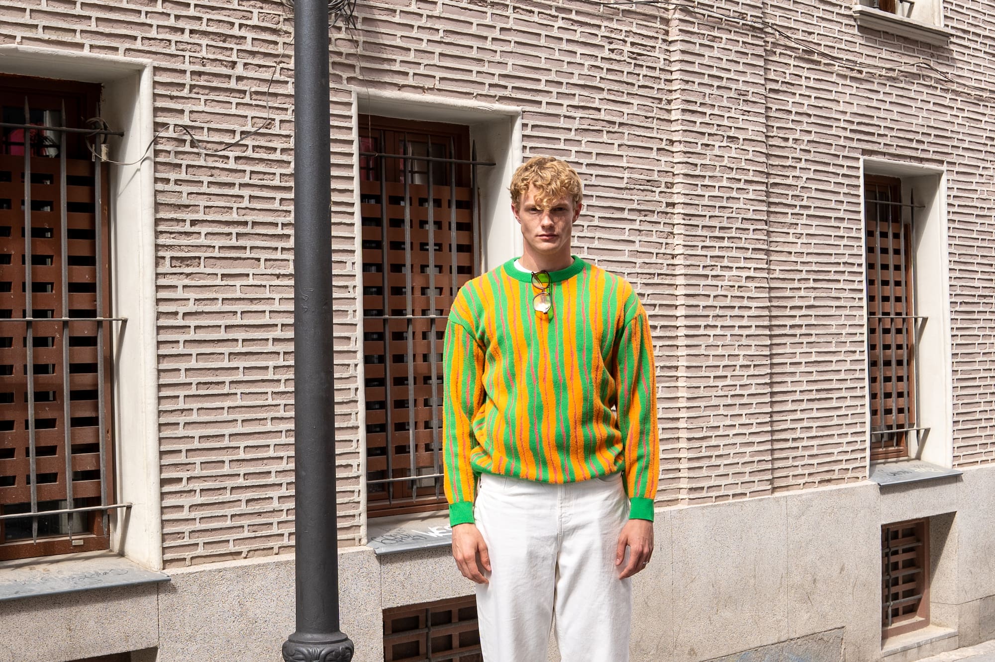 a man standing on a street lamp