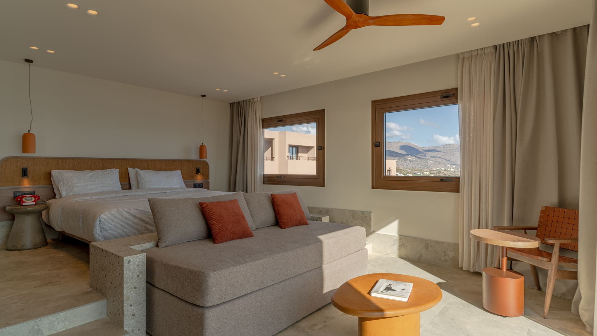 a room with a bed and a ceiling fan