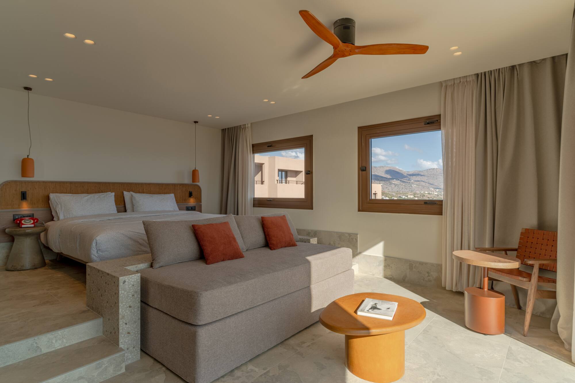 a room with a bed and a ceiling fan