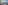 Balcony overlooking blue ocean, beach, and coastal road.