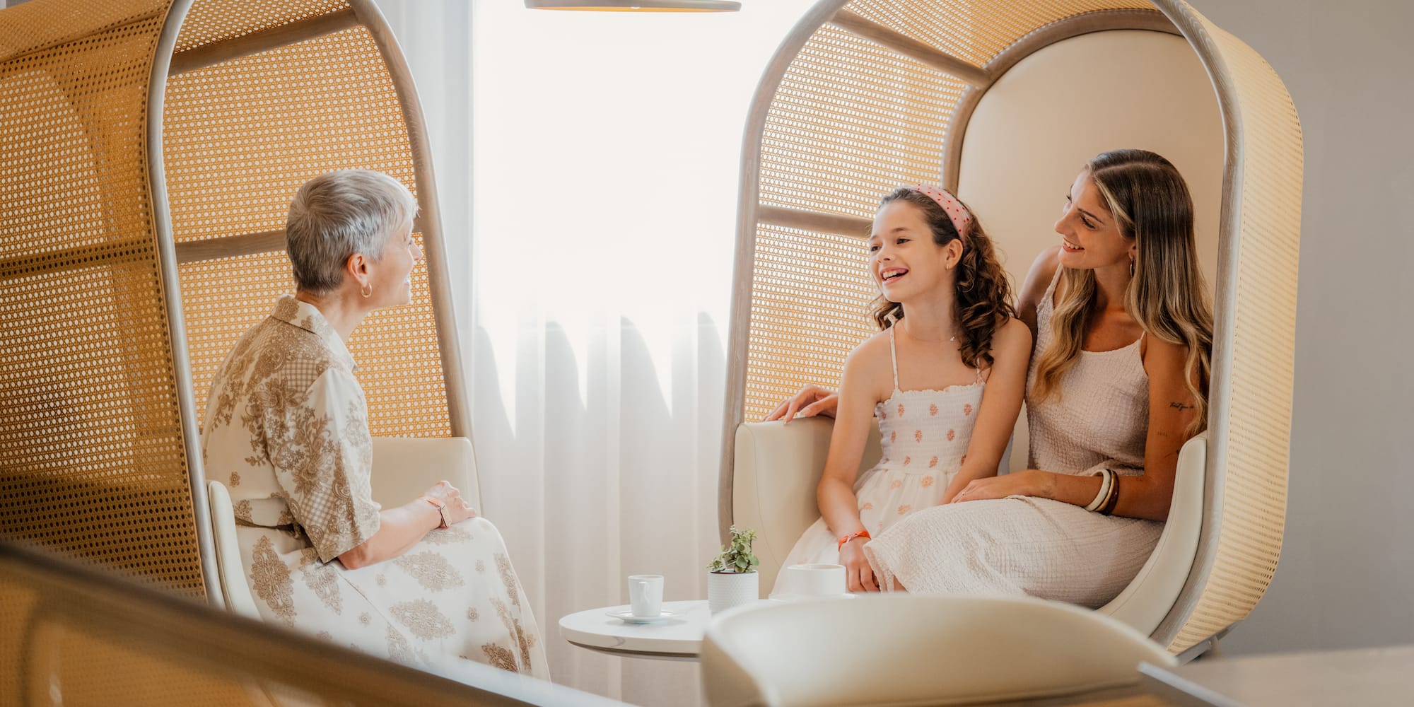 a group of women sitting in chairs
