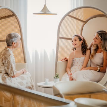 a group of women sitting in chairs