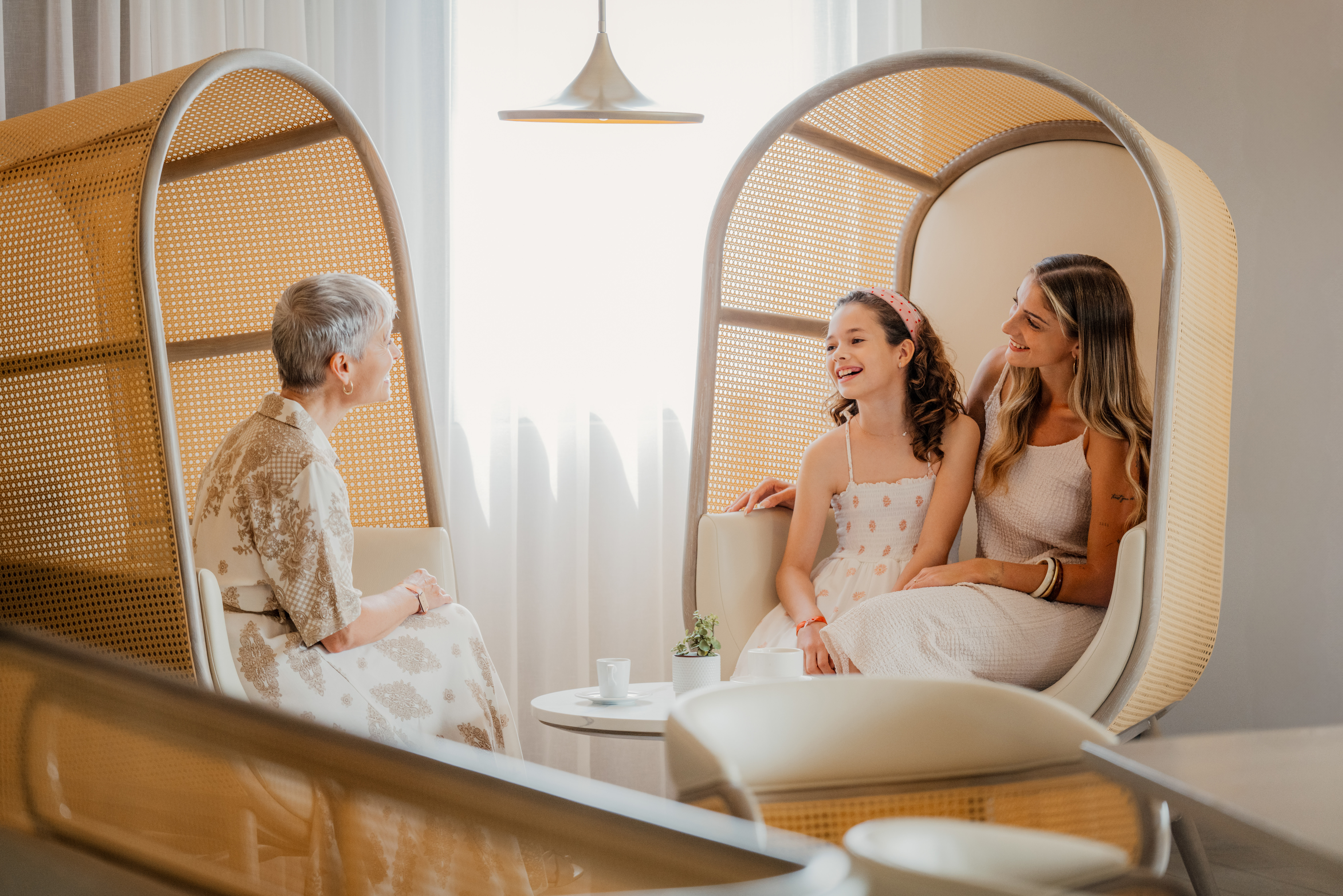 a group of women sitting in chairs