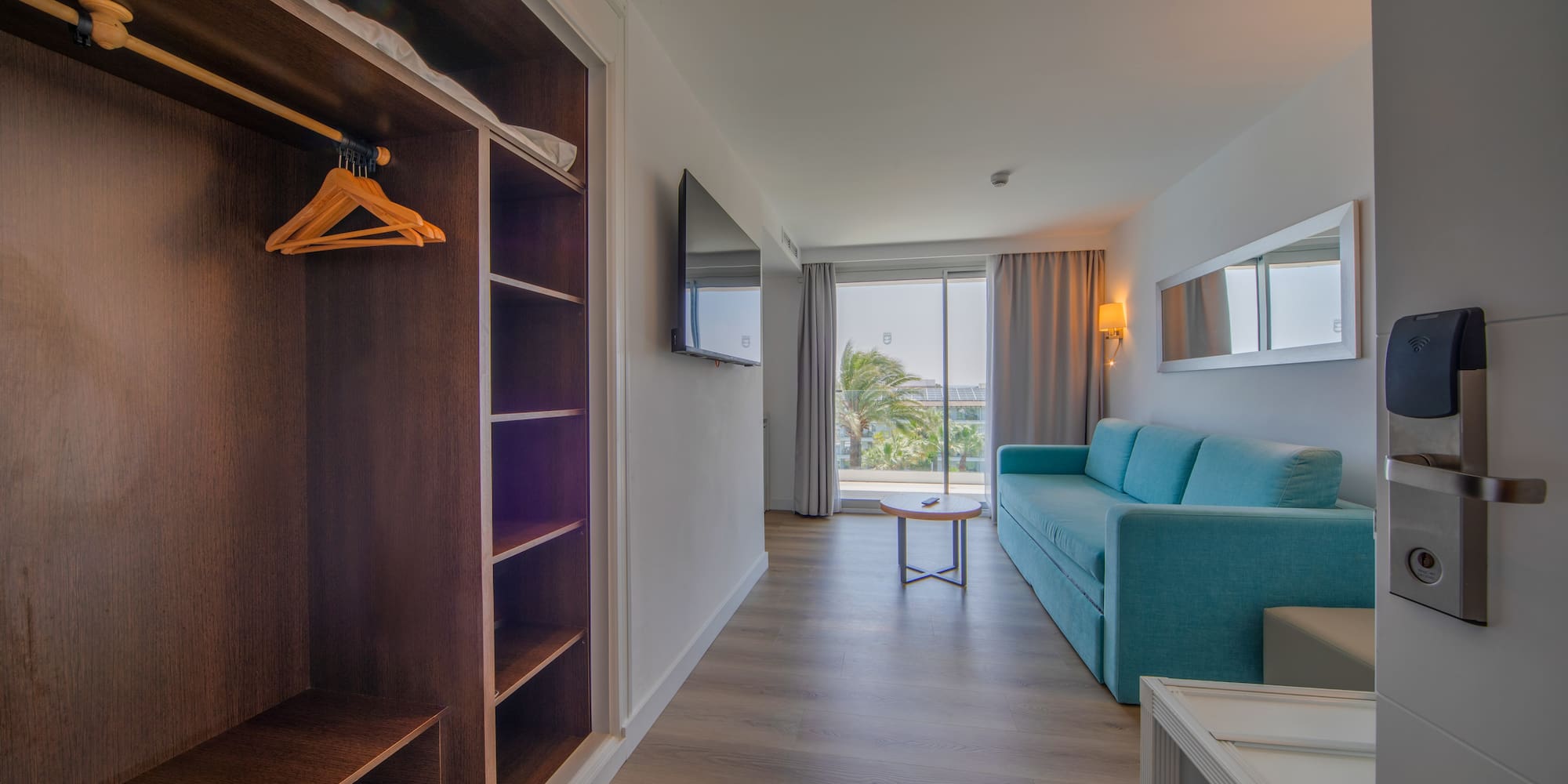 a room with a couch and a shelf