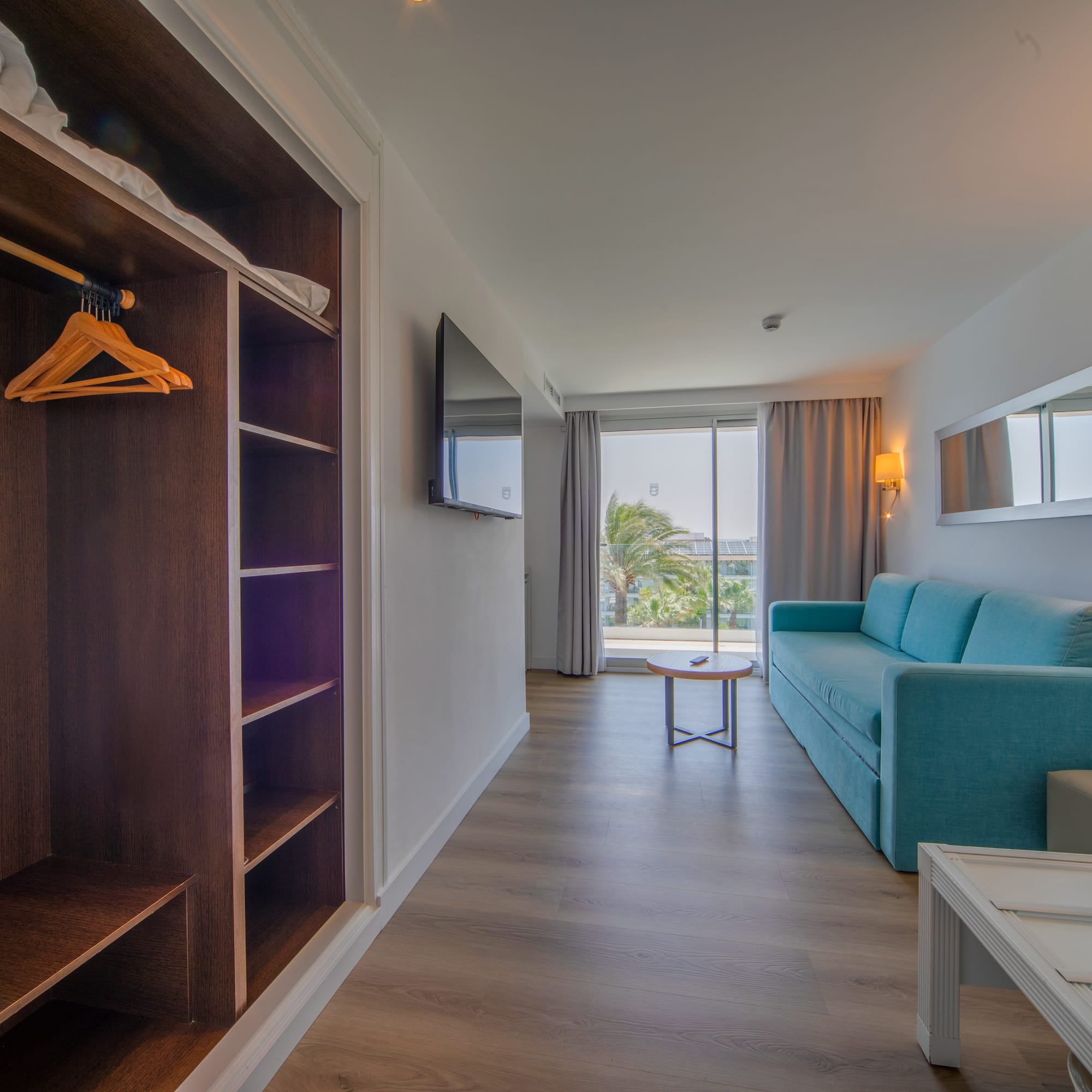 a room with a couch and a shelf