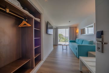 a room with a couch and a shelf