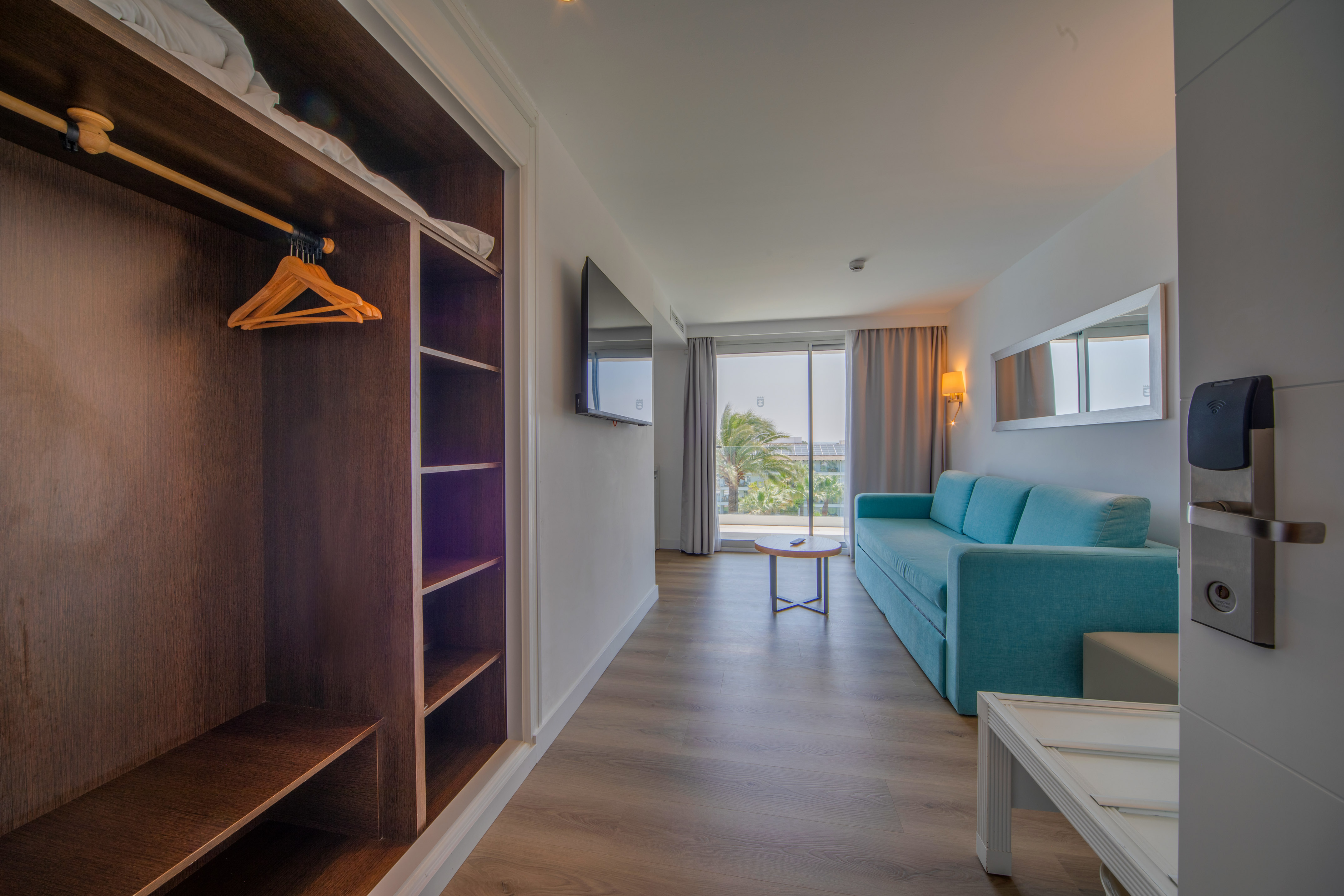 a room with a couch and a shelf
