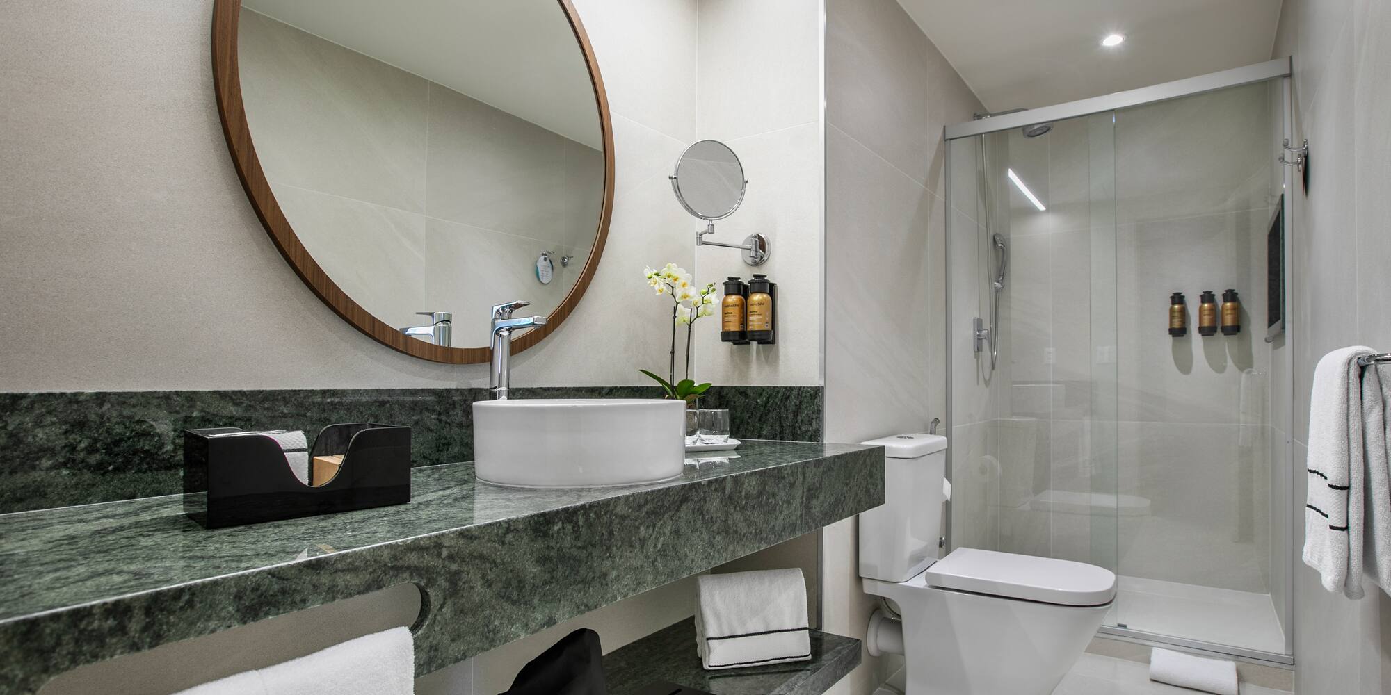 a bathroom with a mirror and sink