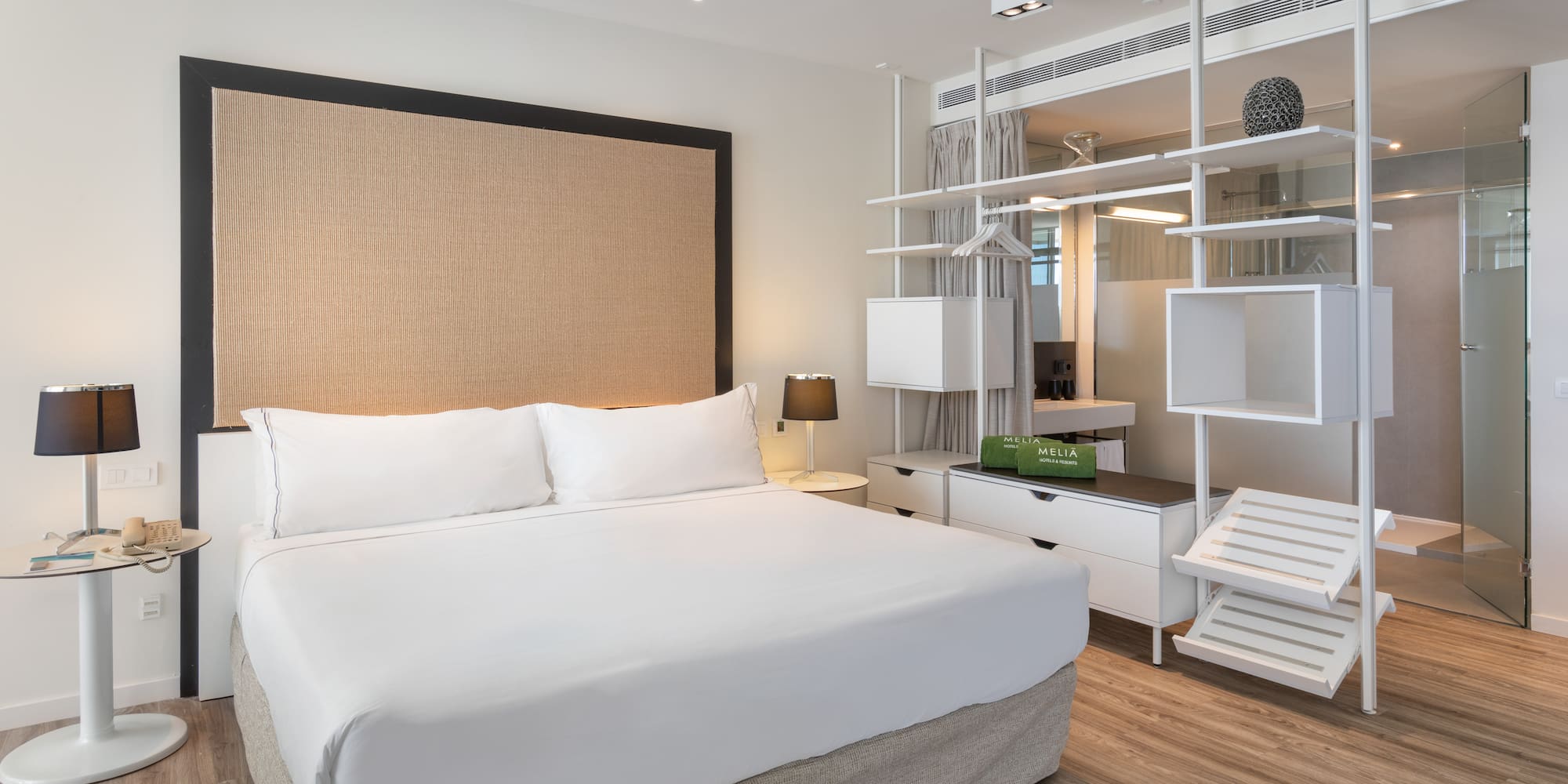 a room with a bed and a shelf