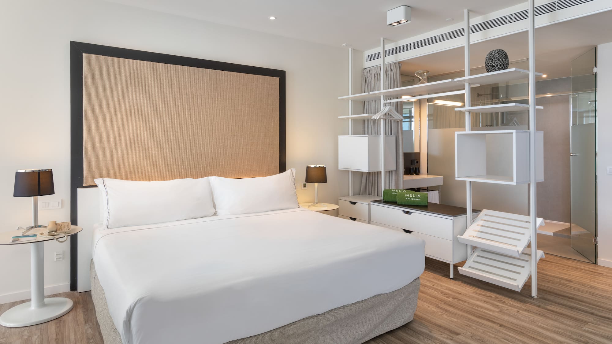 a room with a bed and a shelf