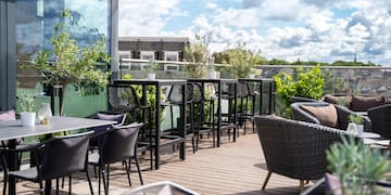 a patio with chairs and tables