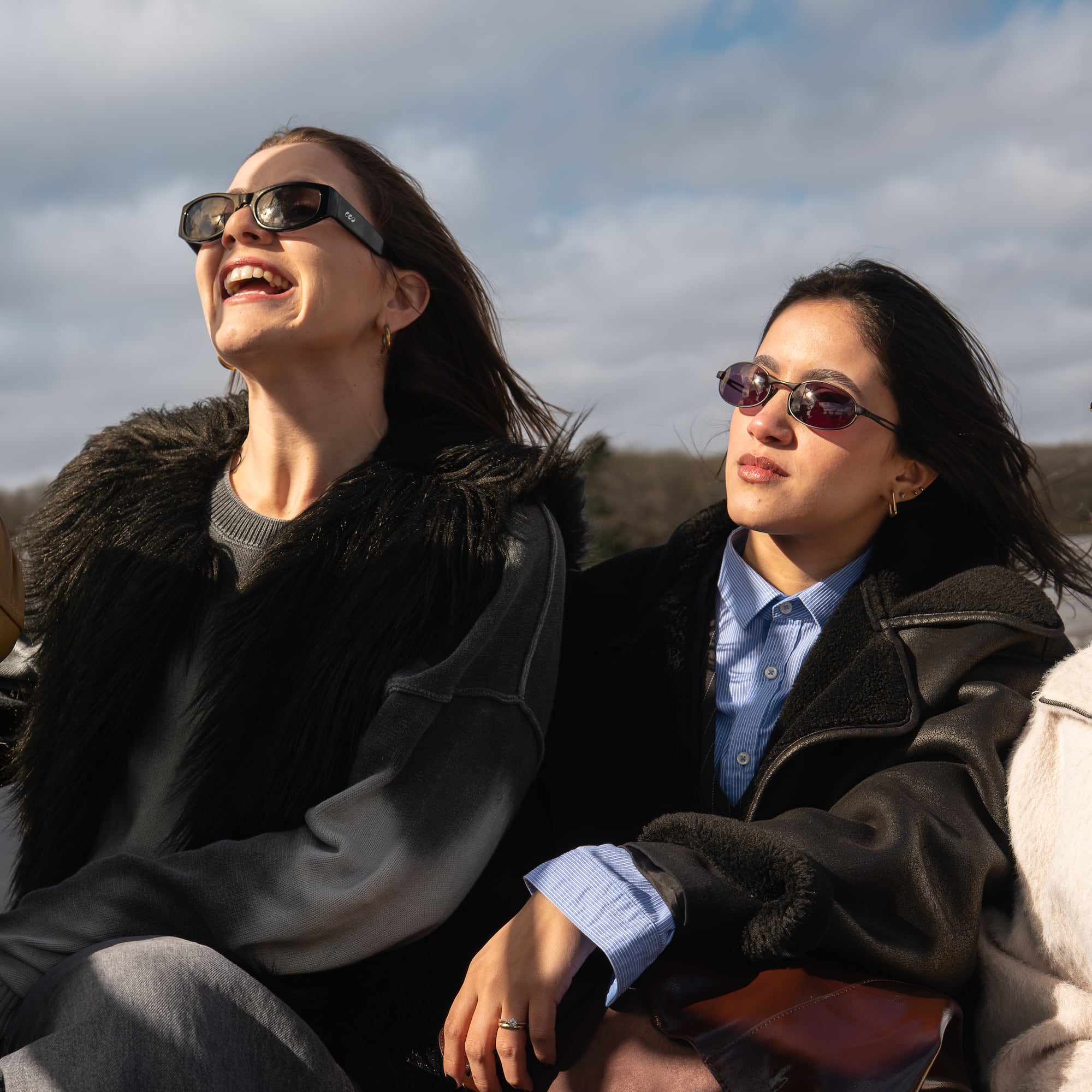 a group of women sitting outside