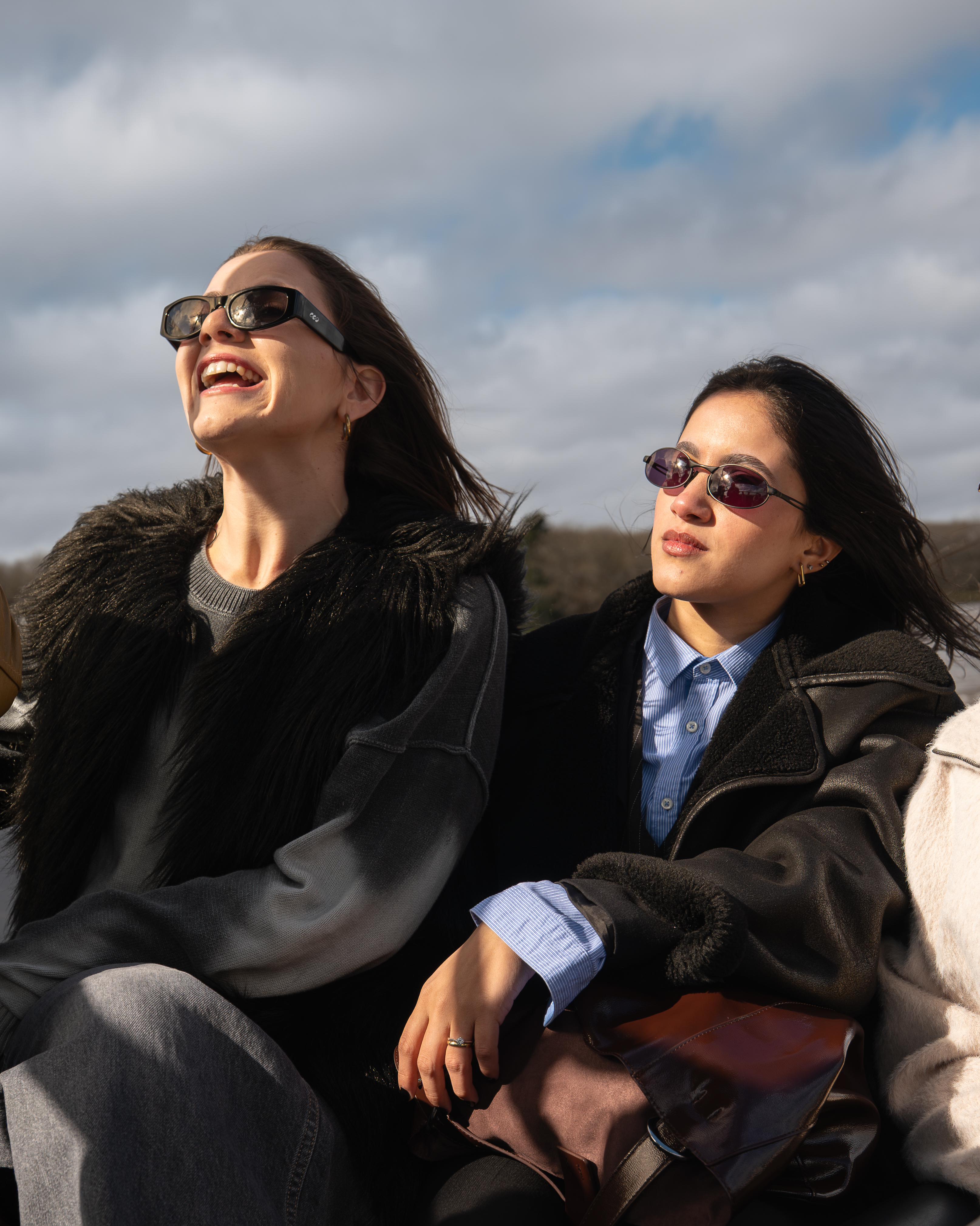 a group of women sitting outside