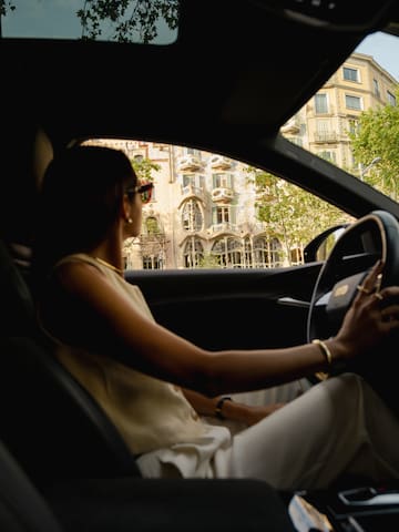 a woman driving a car