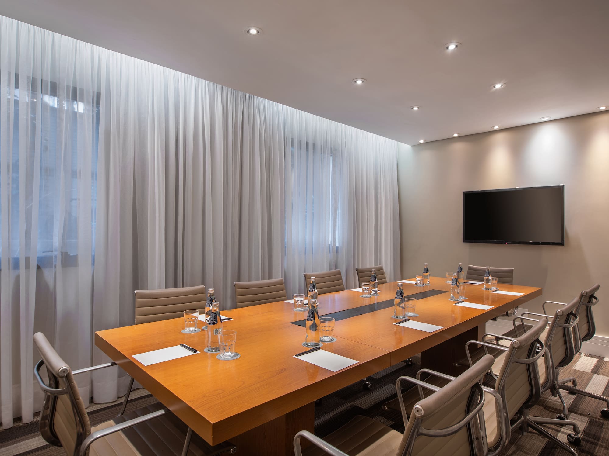 a conference room with a table and chairs