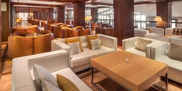 a room with a large table and chairs