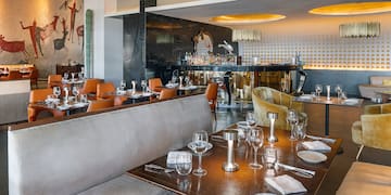 a restaurant with tables and chairs