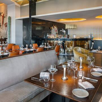 a restaurant with tables and chairs