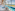 Coastal indoor swimming pool with sea view, jacuzzi, and relaxing lounge area.