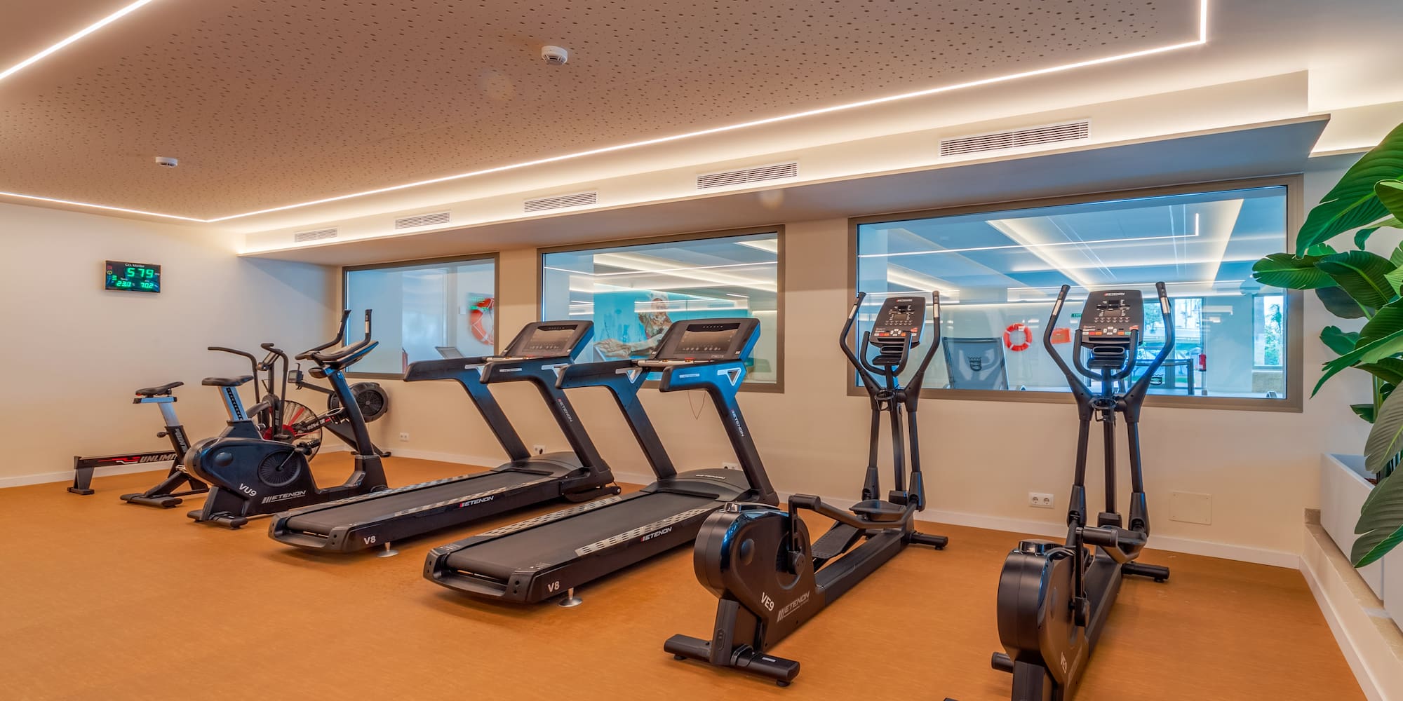 a room with treadmills and exercise bikes
