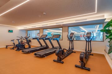 a room with treadmills and exercise bikes