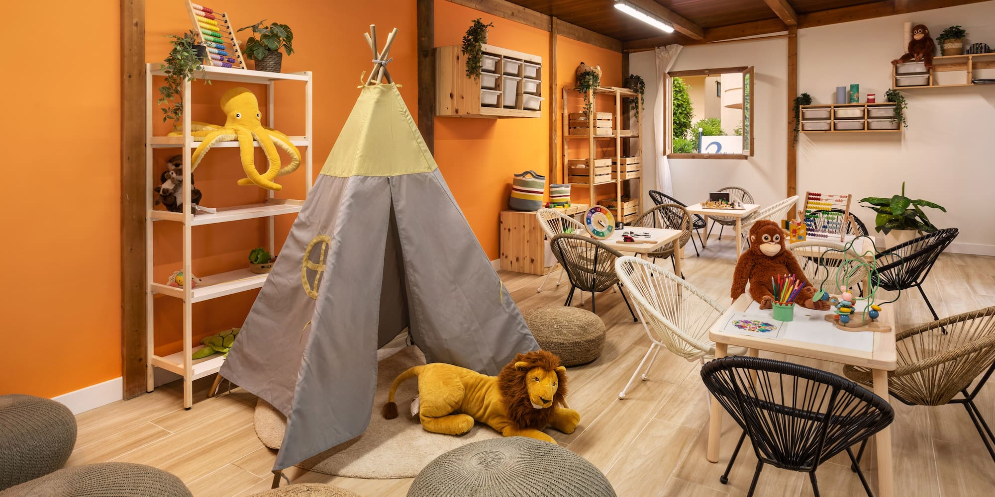 a room with a teepee and stuffed animals