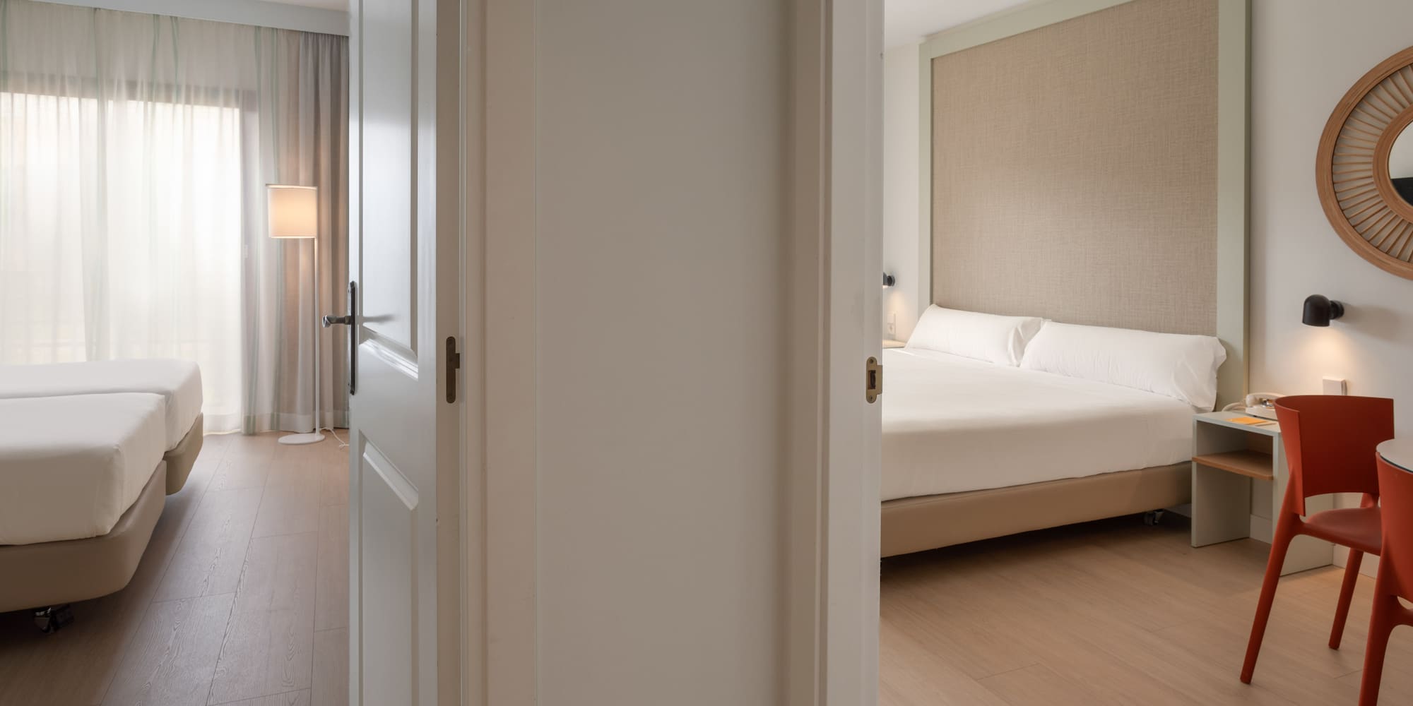 Two hotel rooms with twin and double beds, modern interior, light wood floor.