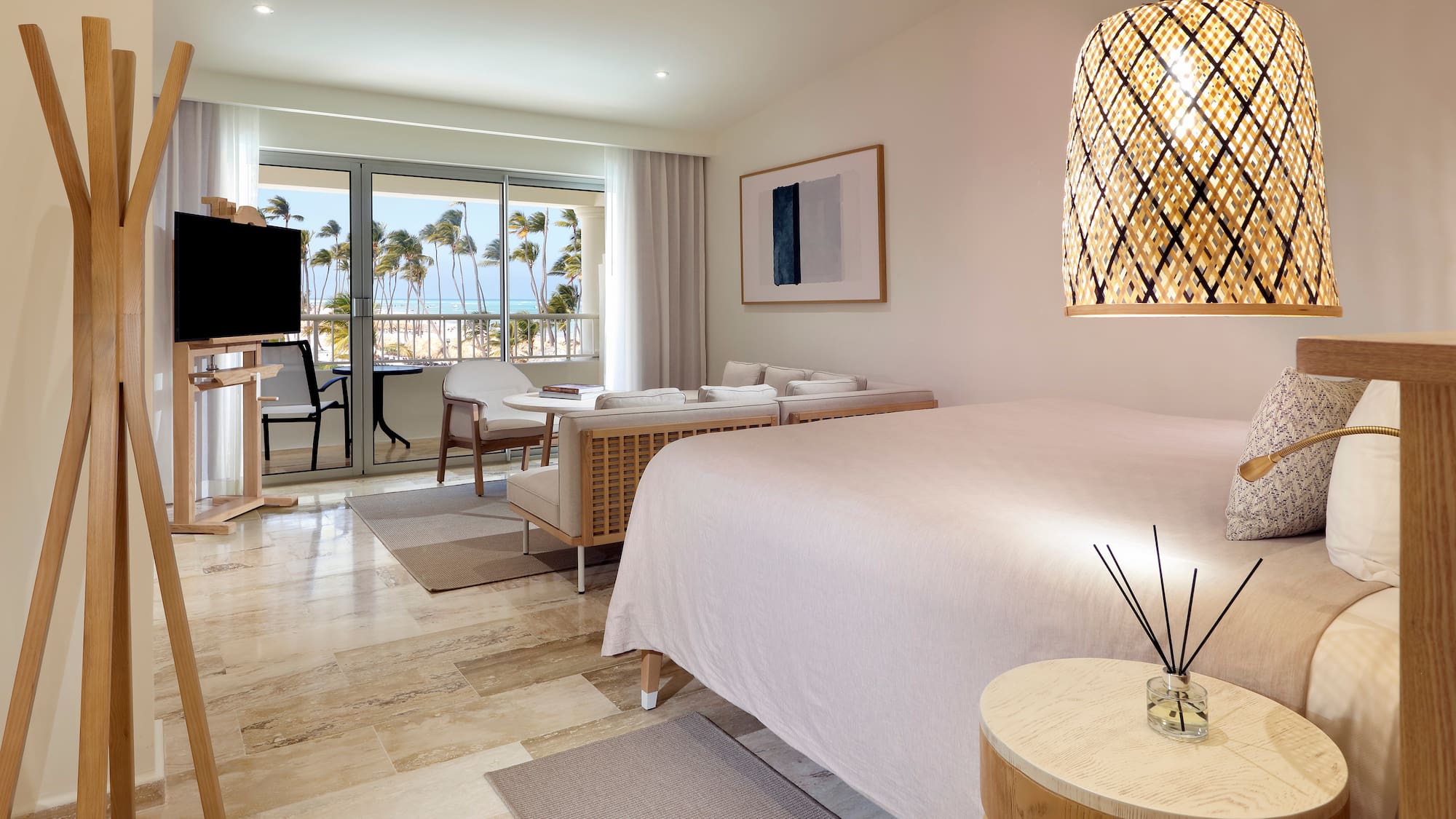 a room with a bed and a table and chairs