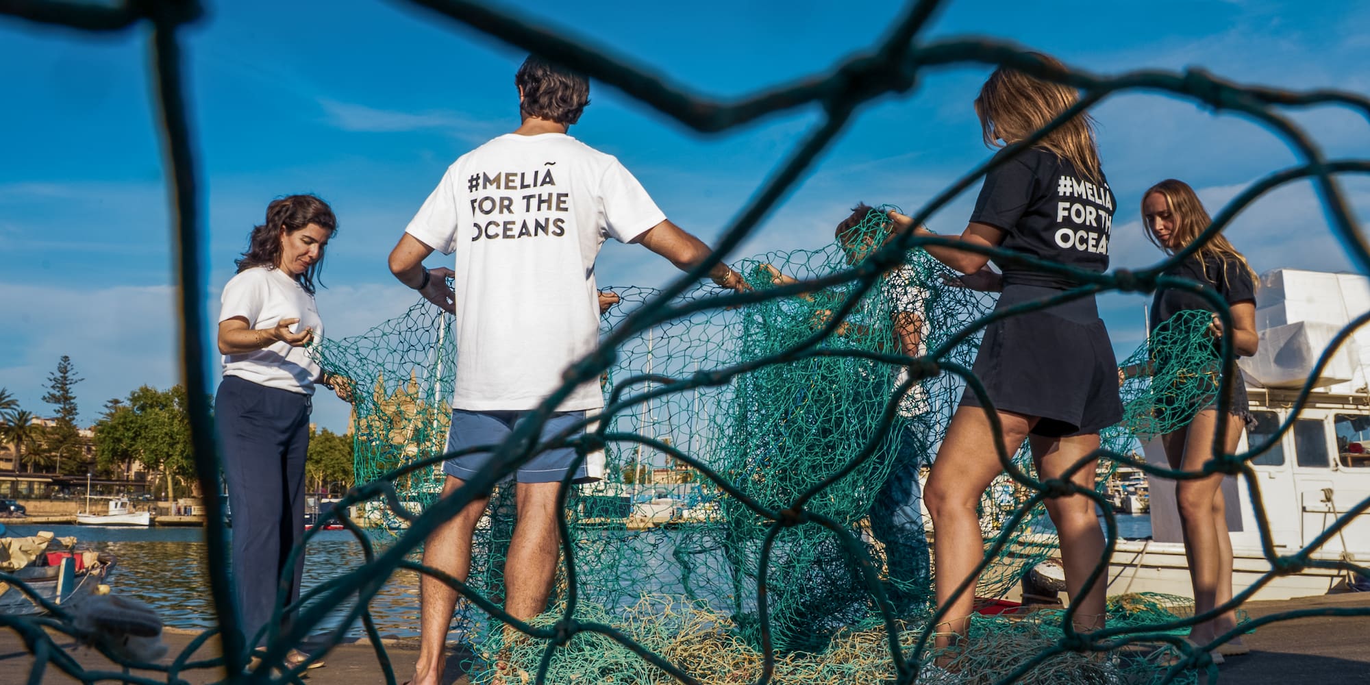 a group of people standing in front of a net